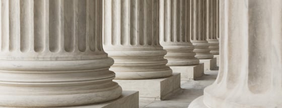 Close-up view of rows of white classical columns.