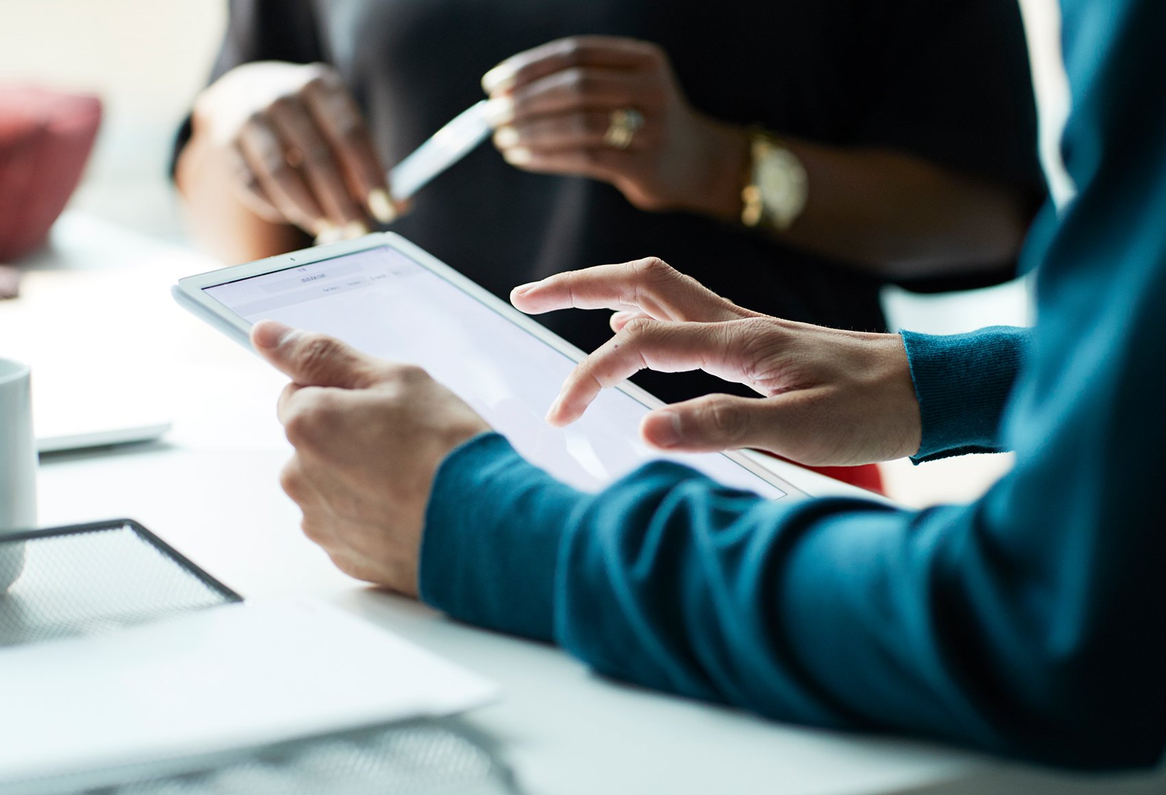 Image of people in a meeting working together